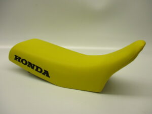 Buddy/Zadel - Geel + zwart "HONDA" (opnieuw bekleed)